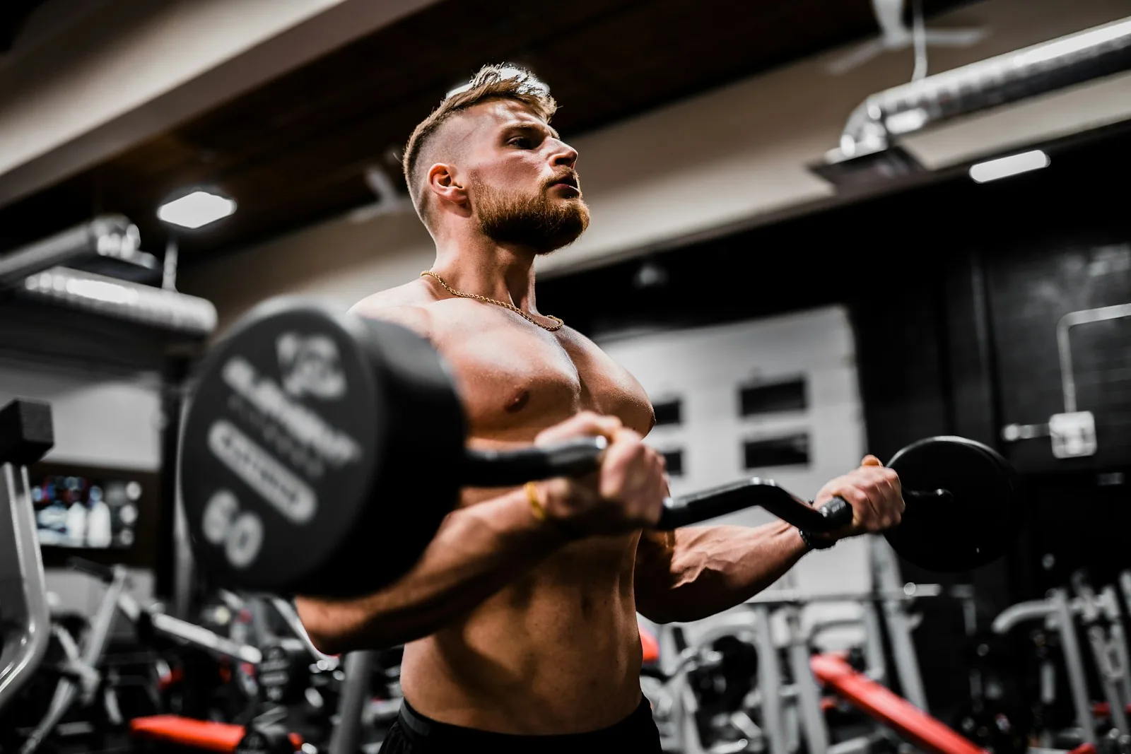 Athlete training with free weights